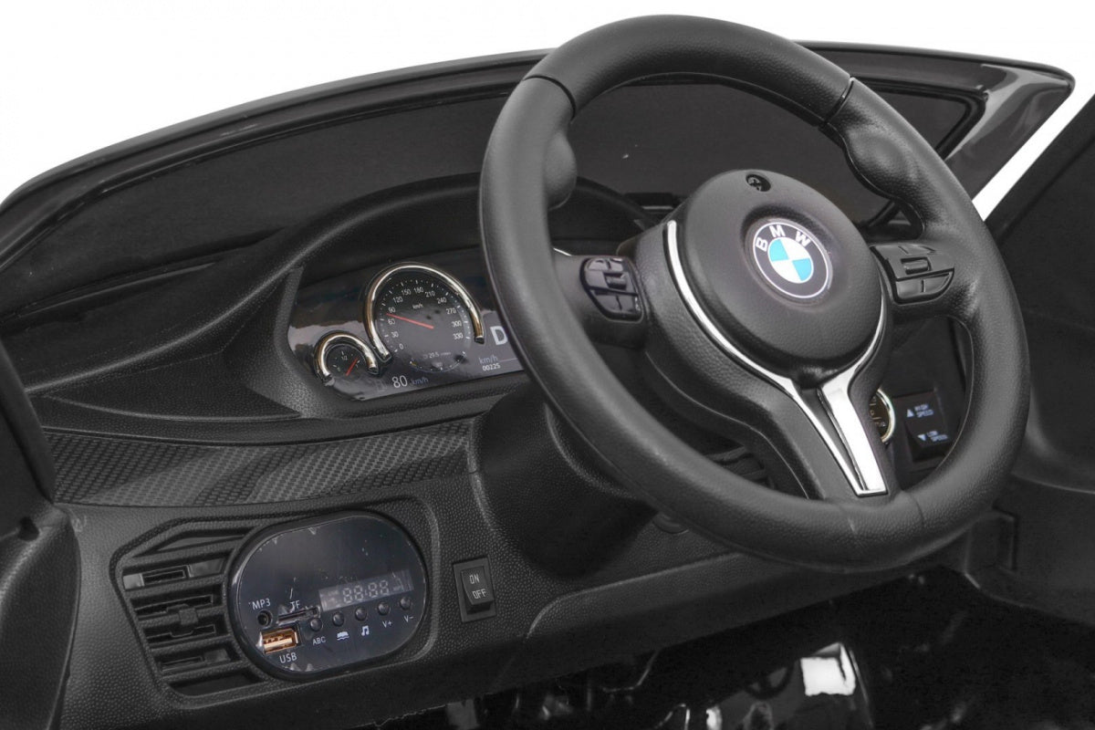 Licencirani auto na akumulator BMW X6M - crni/lakirani