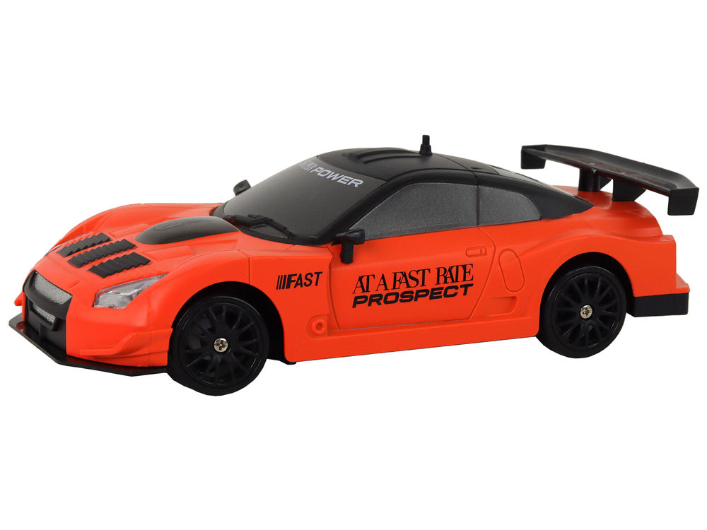 Auto na daljinsko upravljanje R/C 1:24  s izmjenjivim kotačima - narančasti