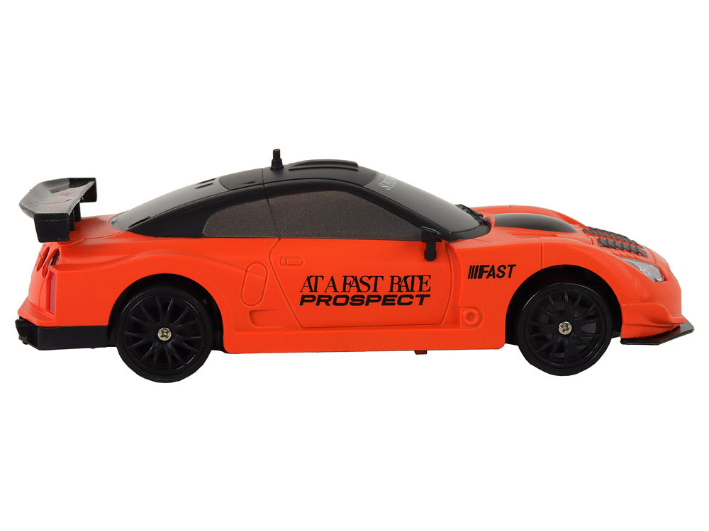 Auto na daljinsko upravljanje R/C 1:24  s izmjenjivim kotačima - narančasti