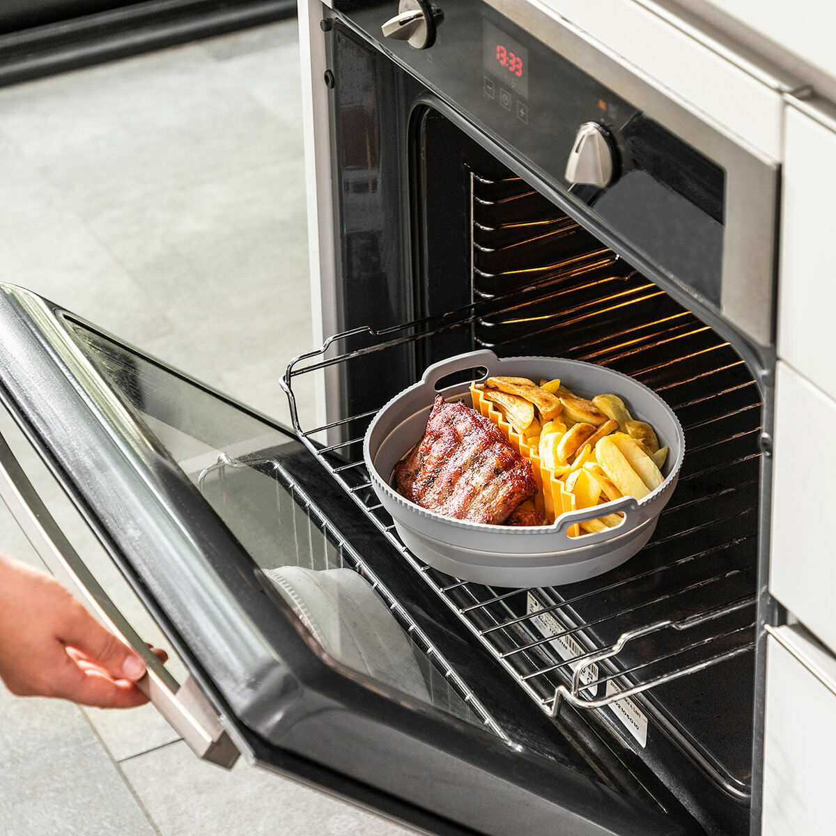 Paket sklopivih silikonskih košara s ručkama i separatorima za zračnu fritezu InnovaGoods (3 komada)