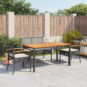 4-dijelni vrtni blagovaonski set od poliratana s jastucima crni Crna 140 cm table length